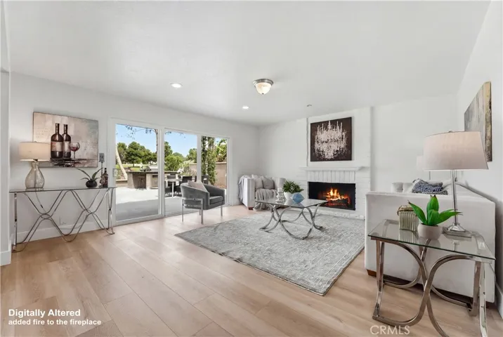Beautiful Family Room with Fireplace and access to the backyard through sliding doors.