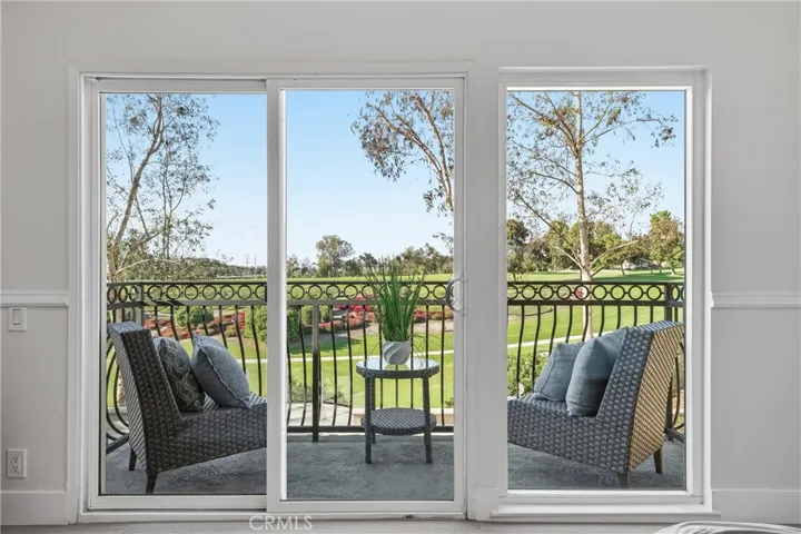 Primary Bedroom Balcony over looking the backyard and golfcourse.