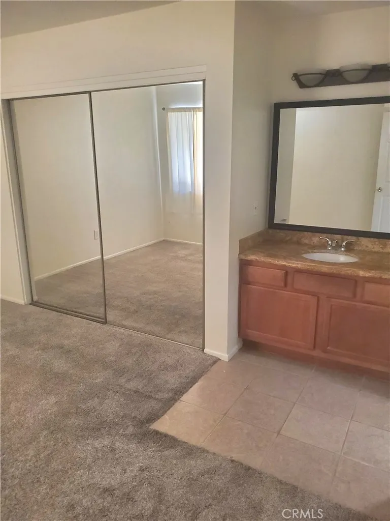 Bedroom 2 Closet and Sink to Bathroom