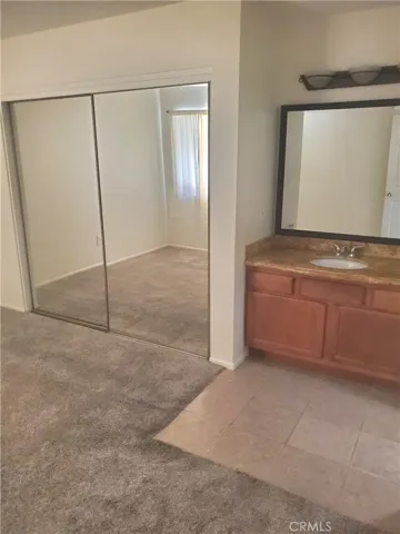 Bedroom 2 Closet and Sink to Bathroom