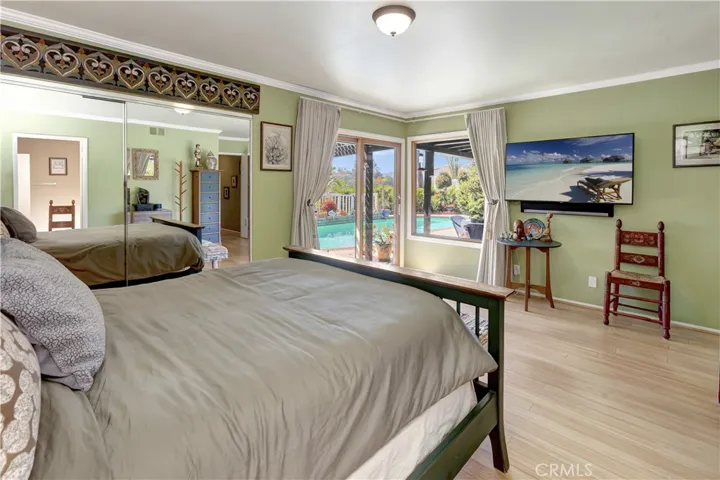 Primary bedroom looking out towards private pool and spa.