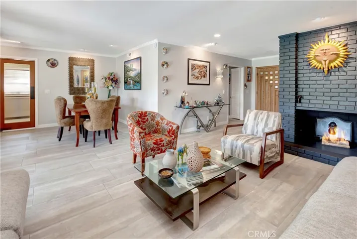 Living room with fireplace and adjoing dining room.
