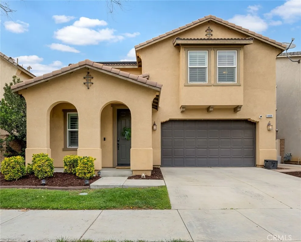 Two car garage with one step to the front entrance door