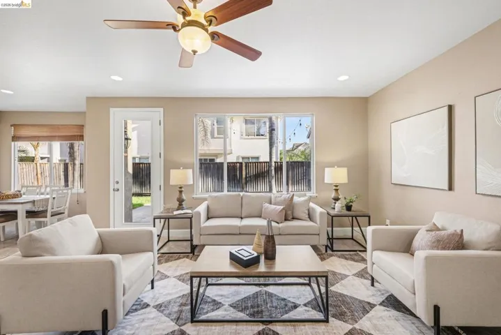 Living area with ceiling fan and recessed lighting