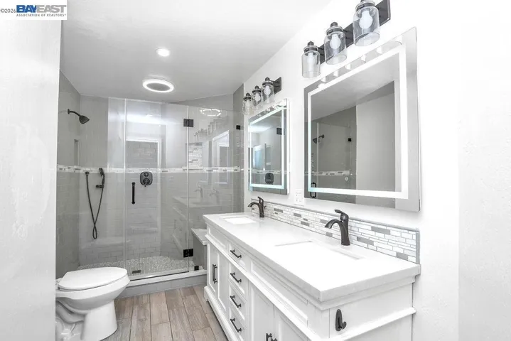 Lots of cool features in here! Bluetooth lighting and music, iluminated mirrors, dual shower heads and more.