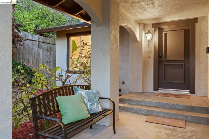 Property entrance featuring stucco siding