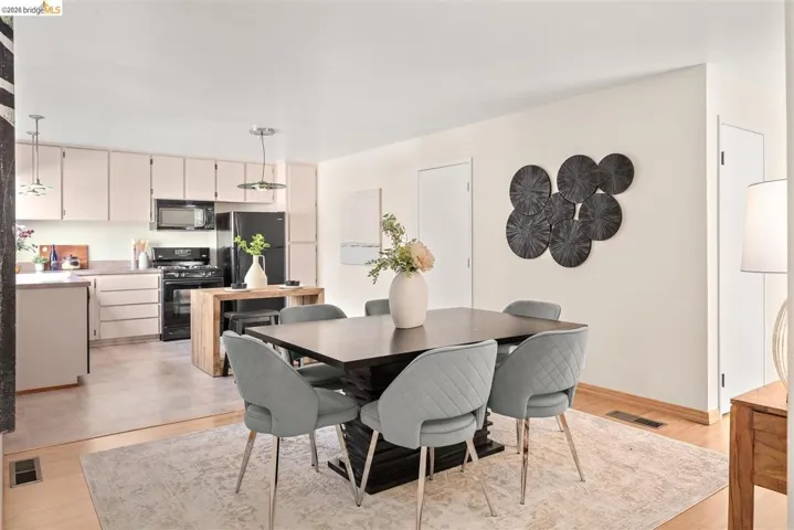 Dining space featuring light wood finished floors and baseboards