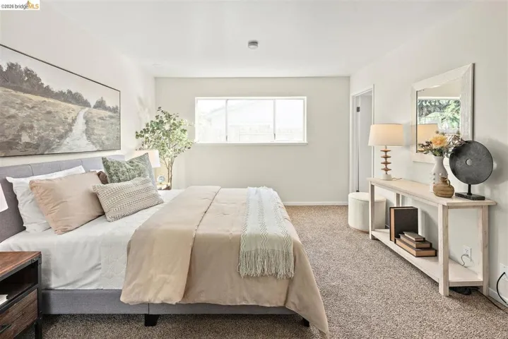 Carpeted bedroom featuring baseboards