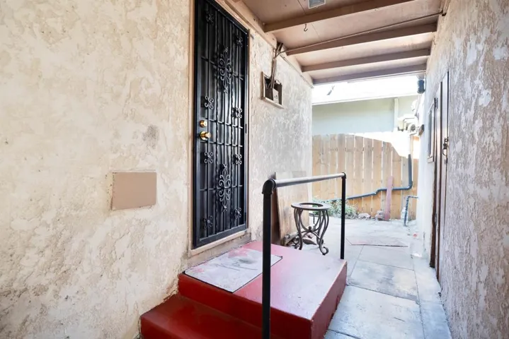 Side entrance. Access to backyard and garage, driveway