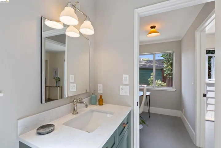 Bathroom featuring vanity and crown molding