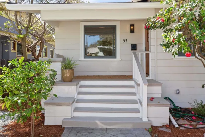 The front porch of this 1920 Craftsman exudes warmth and the built-in bench is a great place to relax.