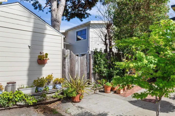 Backyard features two different patio areas as well as a gate opening out to Pleasant Valley Ct.