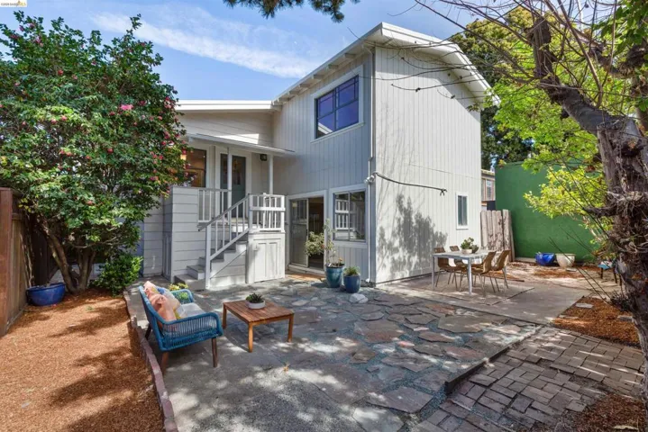 Rear view of property with a patio area and outdoor dining area