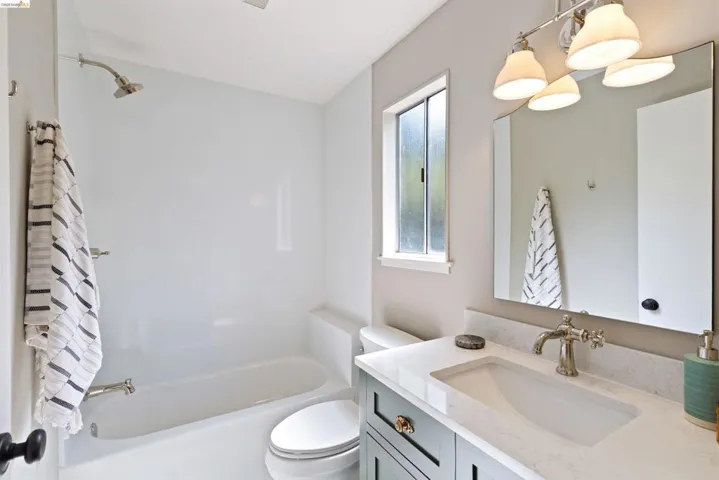 Full bathroom off the family room with a tub.
