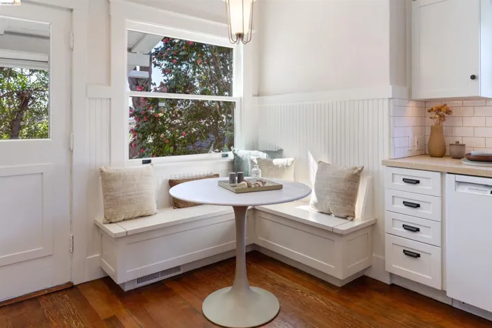 Dining area featuring breakfast area, douglas fir flooring, and wainscoting.