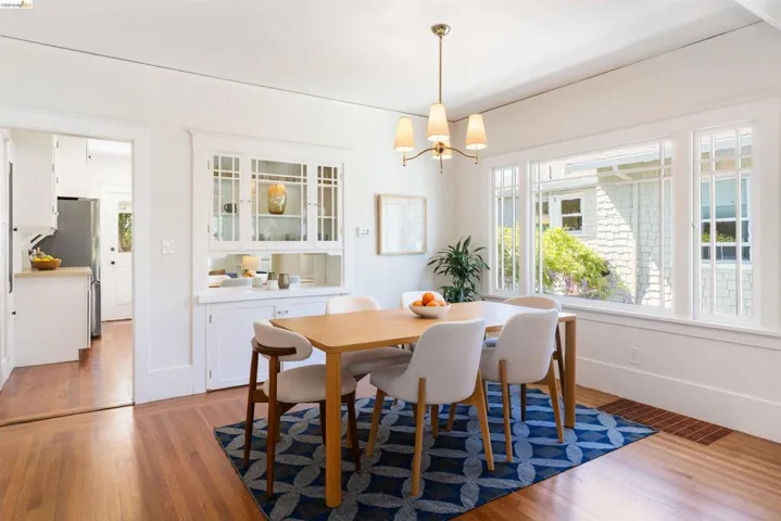 Flooded with light the dining area also features oak hardwood floors.