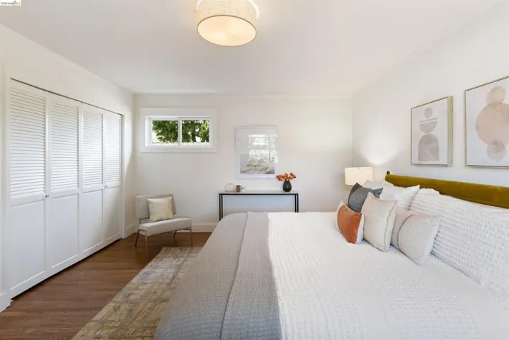 Primary bedroom gets great light.