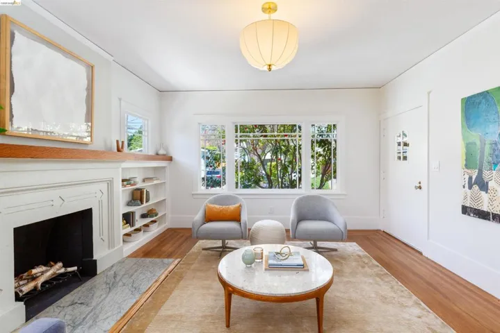 Sunny living room with original details.