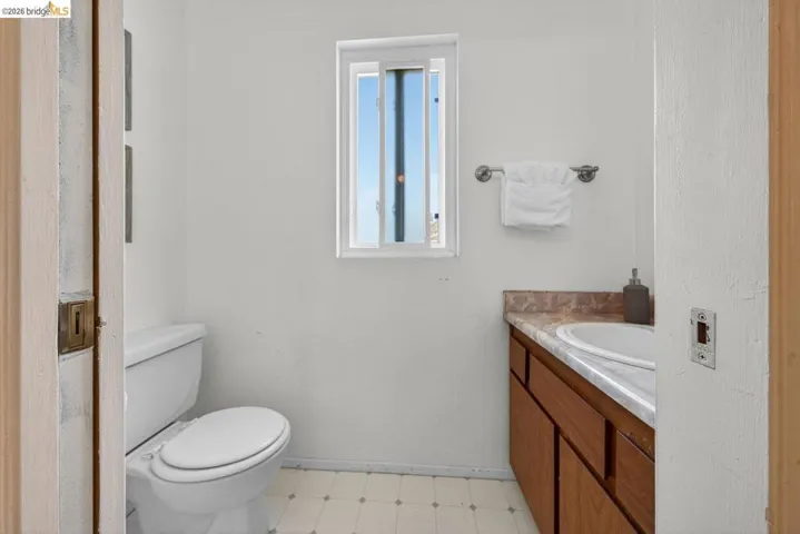 Bathroom featuring vanity and light floors