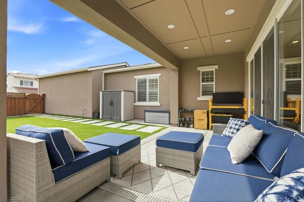 Beautifully designed Low-maintenance backyard, featuring a covered patio for outdoor living.