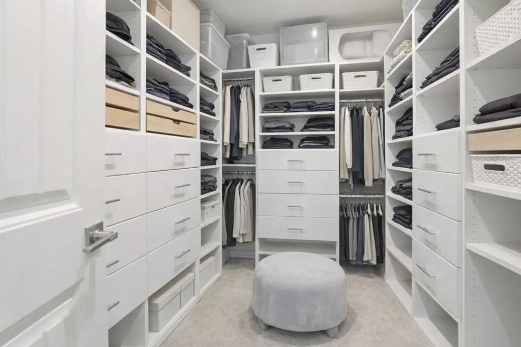 Primary Closet - Spacious custom walk-in closet featuring built-ins, and abundant storage.