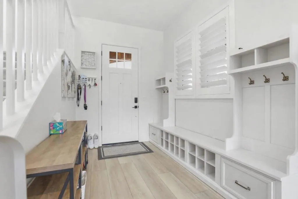 Light-filled entry with custom built-in mudroom and thoughtful storage.