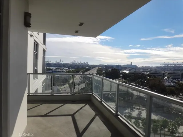 balcony overlooking view of water and bridge