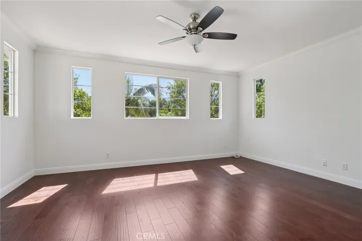 Spacious bedroom with generous natural light and a versatile layout