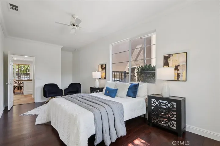Spacious main floor bedroom with natural light and a comfortable layout