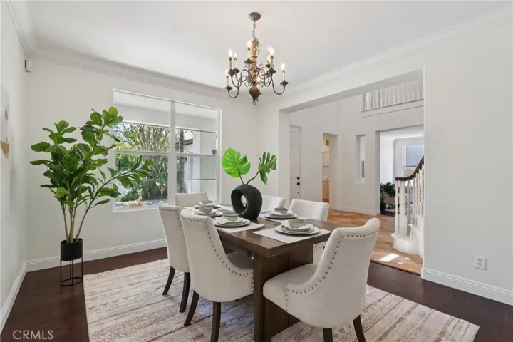 Formal dining area just off the foyer with easy flow to the staircase and main living spaces