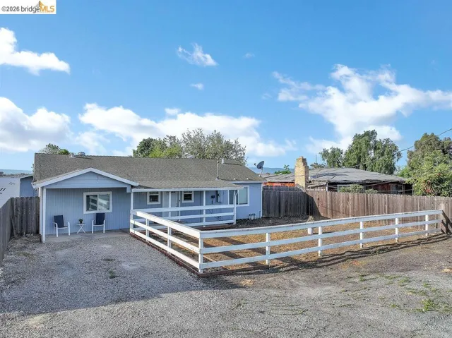 Ranch-style home featuring a fenced backyard