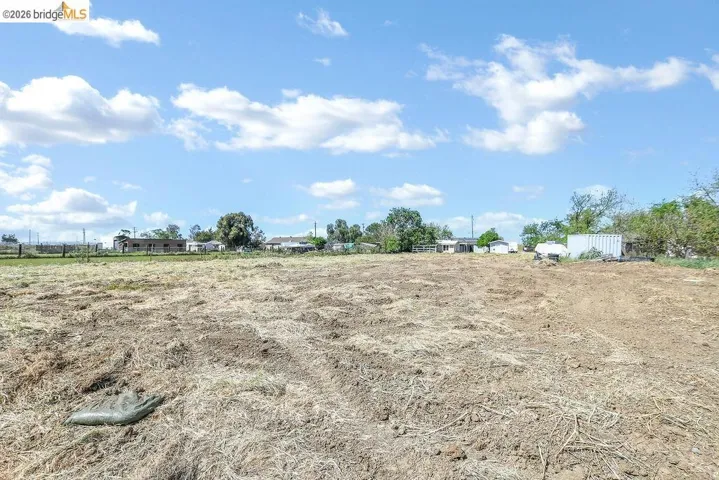 View of yard with a rural view