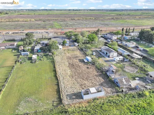 Aerial view of property and surrounding area with rural landscape and extensive farmland