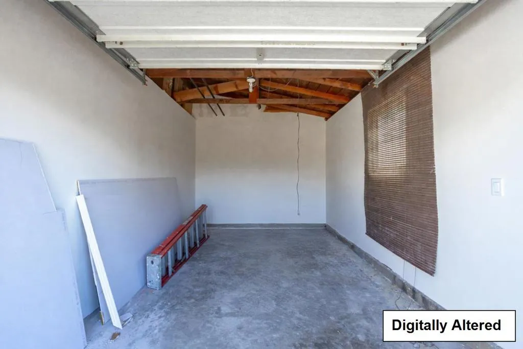 Unit 1122 Garage: digitally alerted. Removed debris from the middle of garage to show entire space.