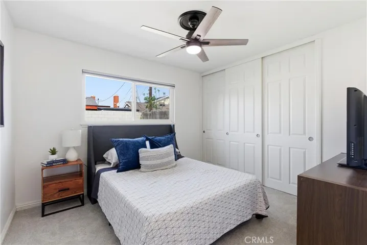 Bedroom 2 with dual door closet and ceiling fan