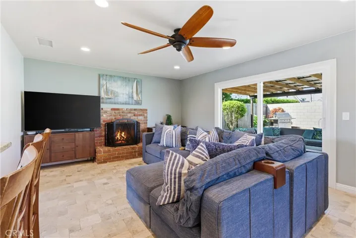 Spacious living room with sliding door access to backyard