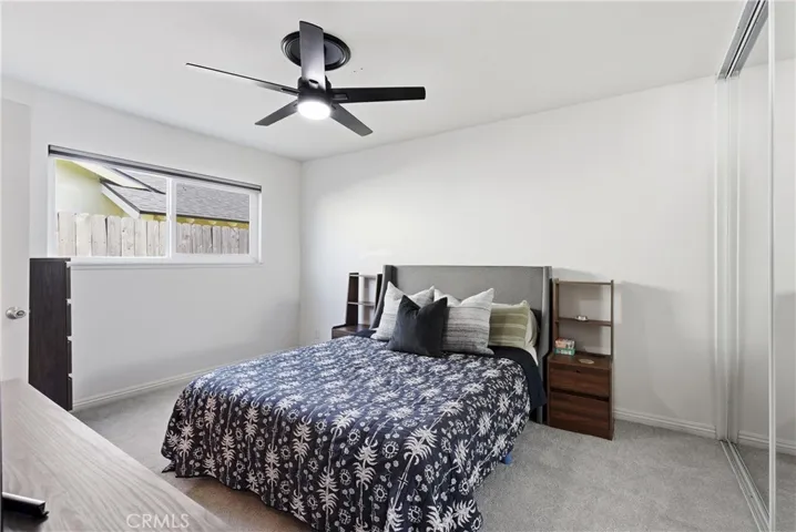 Primary bedroom with 8' high mirrored closet doors