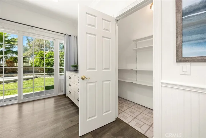 Check out this long, deep storage closet—perfect for keeping everyday essentials organized or showcasing your collection of shoes and purses in style!