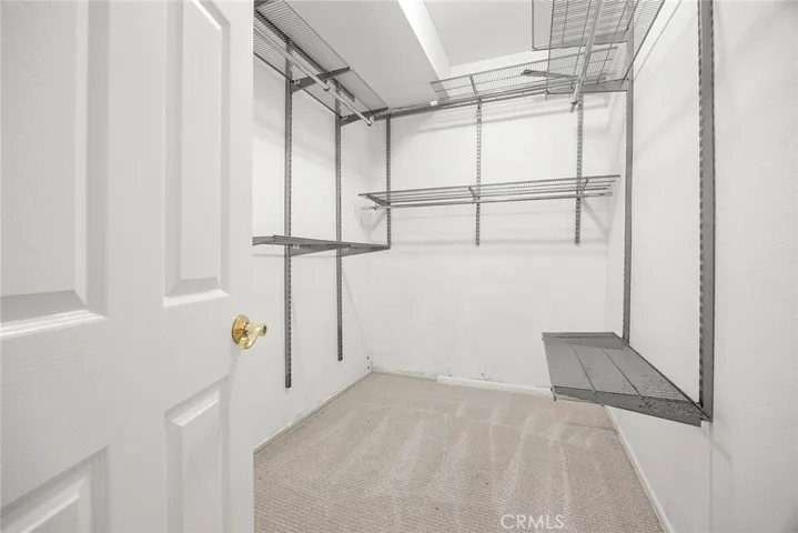 Wow—just what you’ve always wanted! Spacious primary walk-in closet with plenty of room to organize and store with ease.