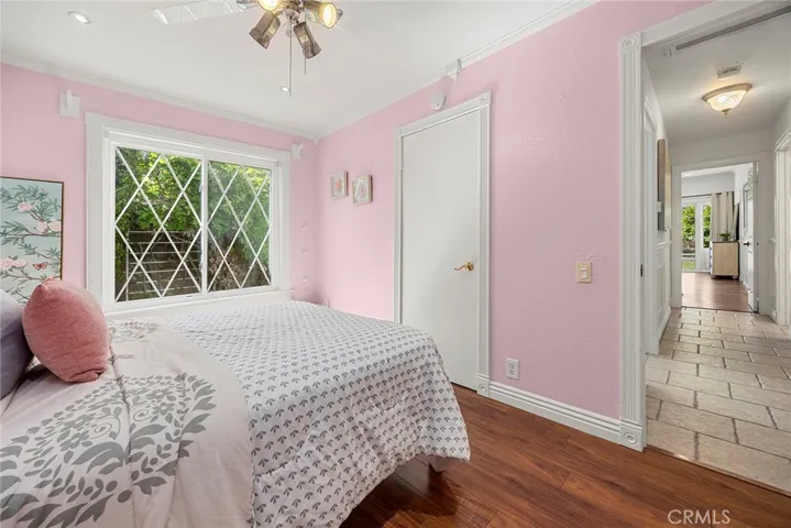 Another view of the bedroom facing the hallway and primary bedroom.
