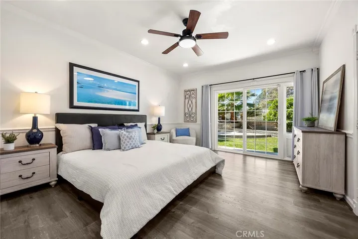 Primary bedroom is spacious and private offering direct backyard access through a double-pane slider—open it to enjoy the breeze.