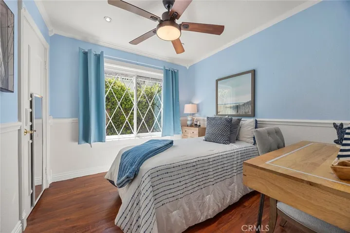 One of the bedrooms was inspired by soft “Frozen”-like hues, featuring a walk-in closet, ceiling fan, crown molding and easy to maintain laminate floors.