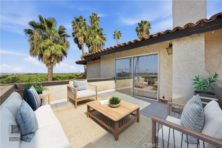 Digitally staged balcony from primary bedroom