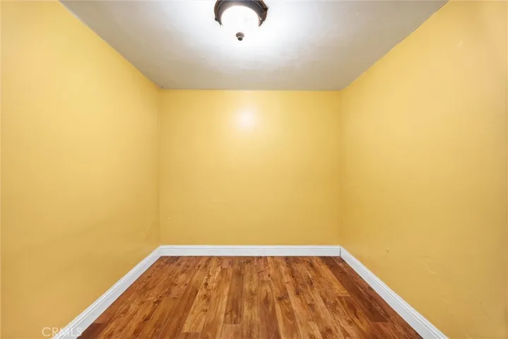 Walk in closet to downstairs bedroom