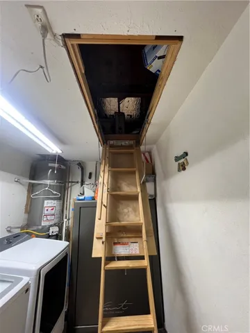 Entry to Attic Storage Space in Laundry Room