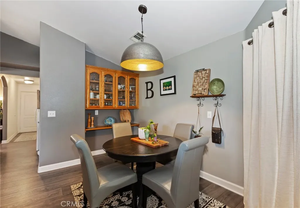 Dining area with cabinets and beautiful light!