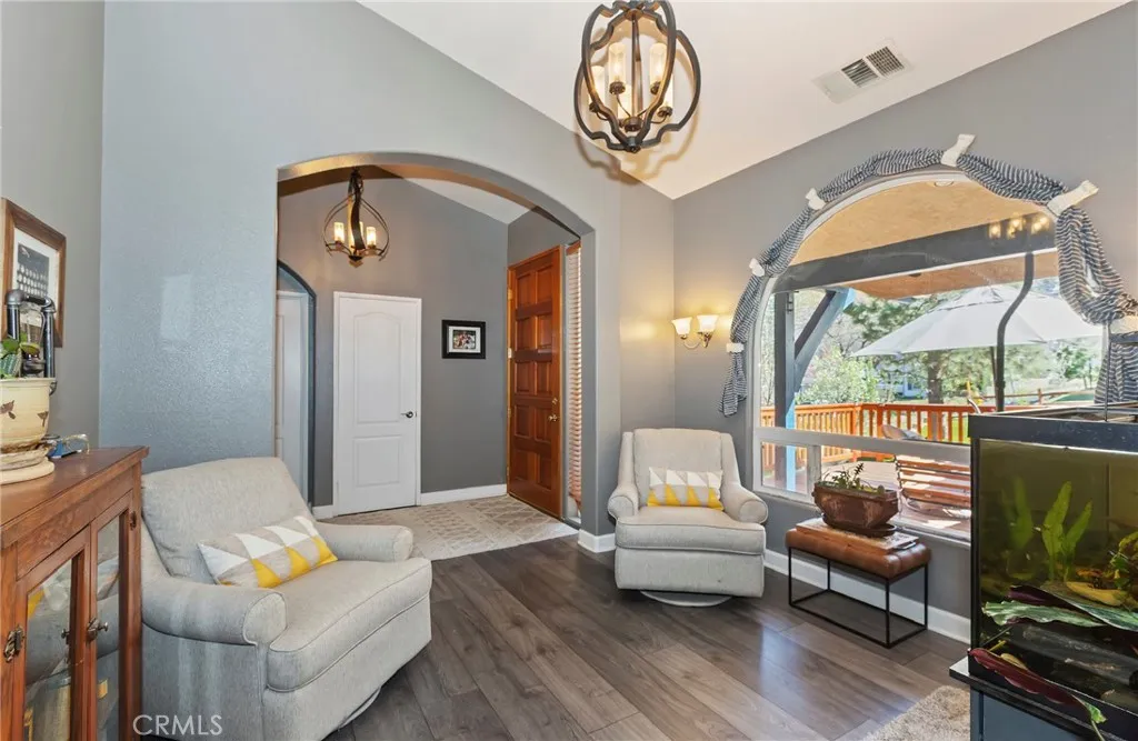Large window enhances this beautiful living room.