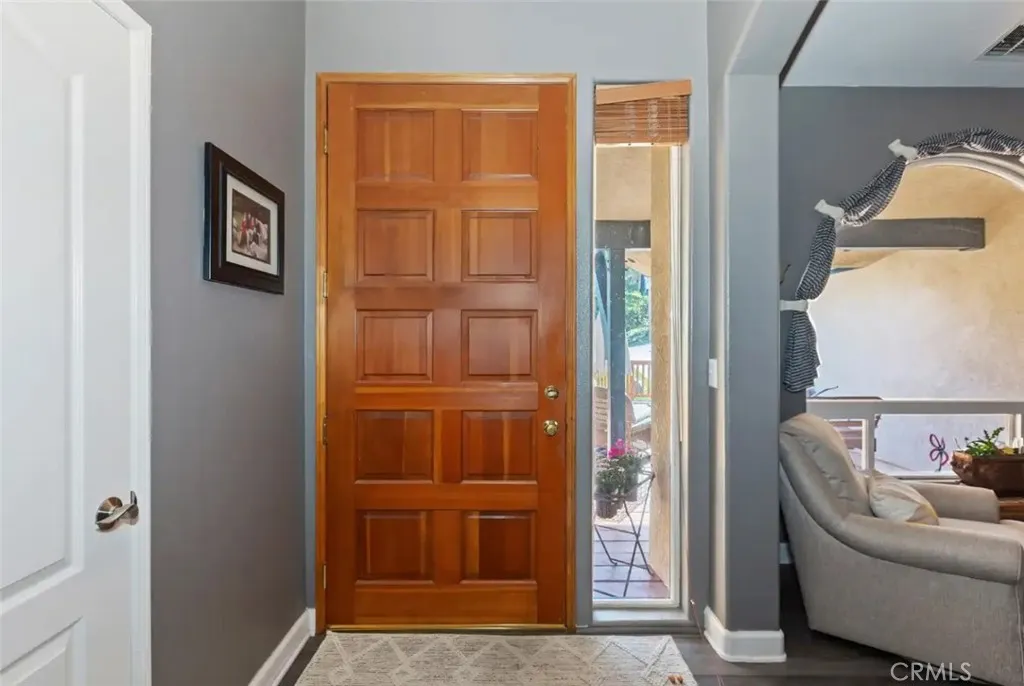 Inside the home. Front door leads to large deck for relaxing or entertaining.