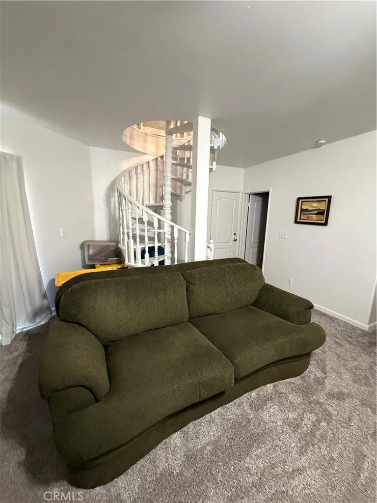 Spiral stairs to upper level.