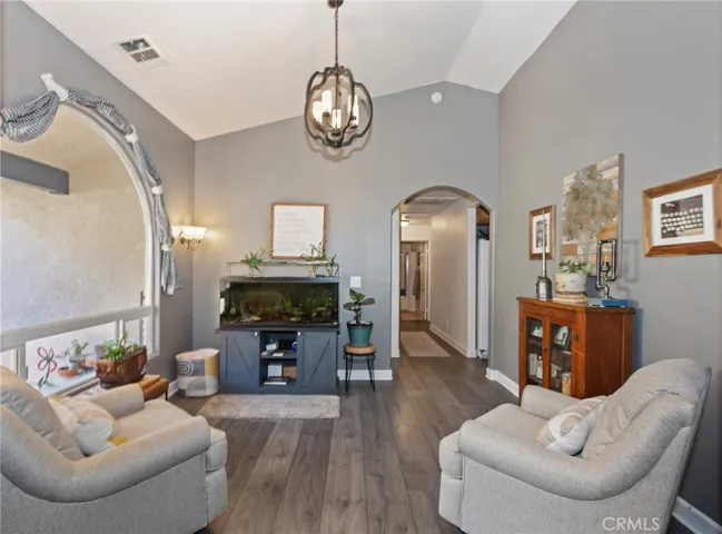 Well lit living room currently with a fish tank to enjoy.